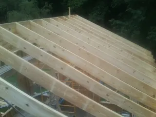 New roof rafters set over an addition before sheathing in Offutt Afb
